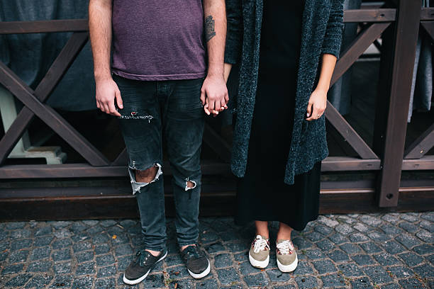 istock couple posing on a city street 620392460