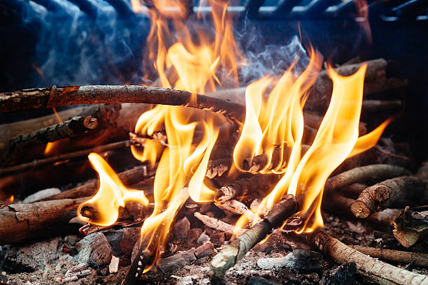 istock Charcoal Burning in BBQ or in the Frame Background . 620392702