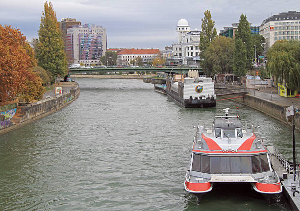 Vienna, Austria - November 7, 2015: people are moving in ships by canal in Vienna, Austria