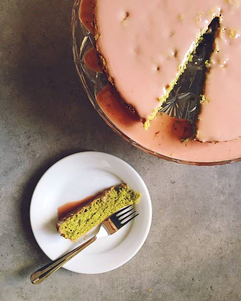 istock Homemade baking: matcha green tea cake with pink cherry icing 620393166