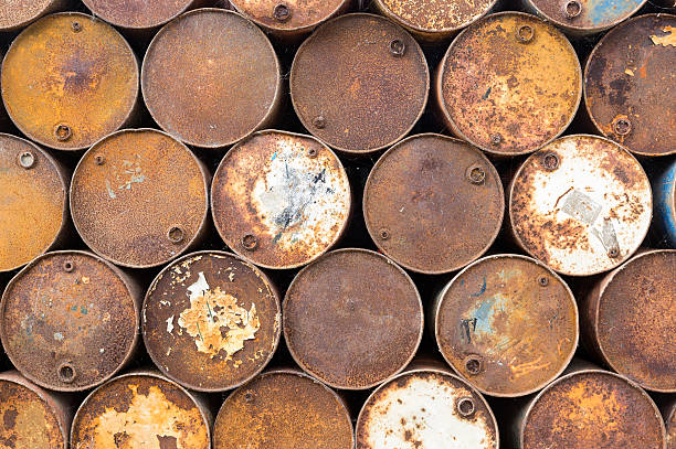 istock Background of old rusty oil barrels 620393554