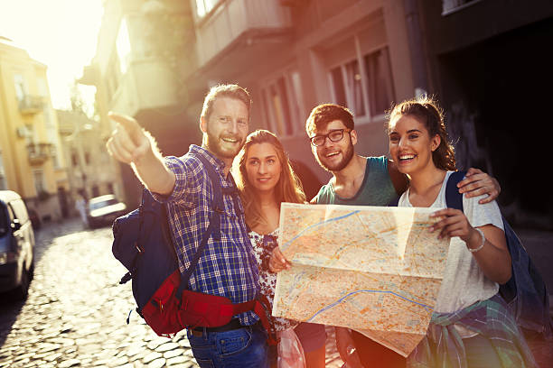 istock Happy tourists exploring city 620393608