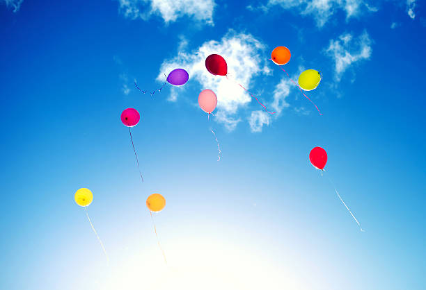 istock Many colorful baloons in the blue sky. 620395322