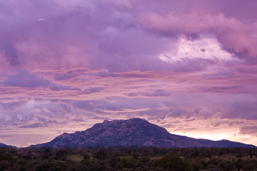 a monsoon storm at sunset over granite mountains Prescott arizona