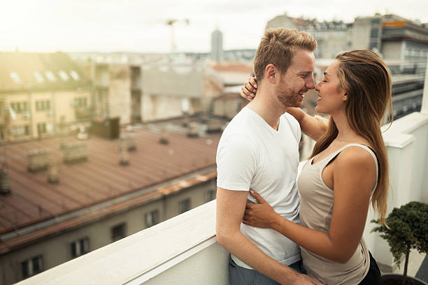 istock Sensual couple rooftop romance 620399932