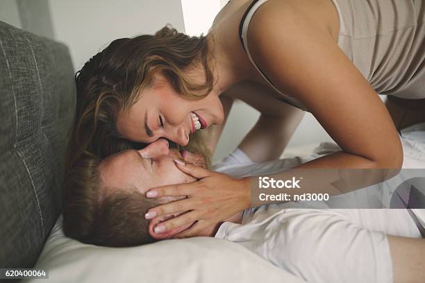 Couple Foreplay In Bed Stock Photo - Download Image Now - Couple - Relationship, Bed - Furniture, Sex and Reproduction