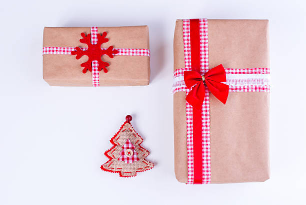 istock Wrapped vintage gift boxes with red ribbon bow 620400378