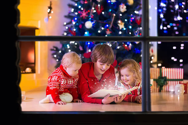 istock Kids playing at fireplace on Christmas eve 620400916