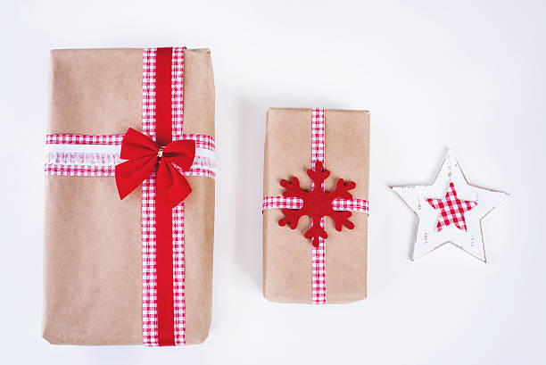 istock Wrapped vintage gift boxes with red ribbon bow 620400982