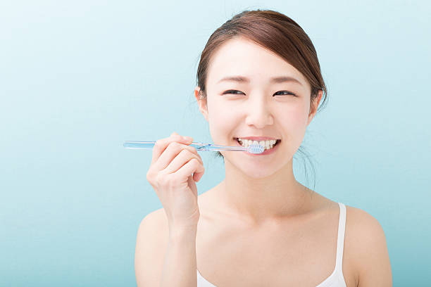 woman 歯みがき - 歯みがき ストックフォトと画像
