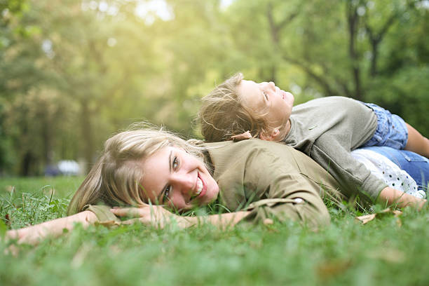 istock Mother with her daughter in the park. 620404784