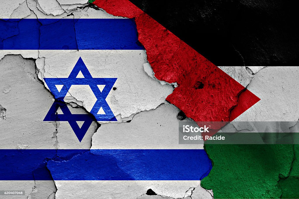 flags of Israel and Palestine painted on cracked wall Israel Stock Photo