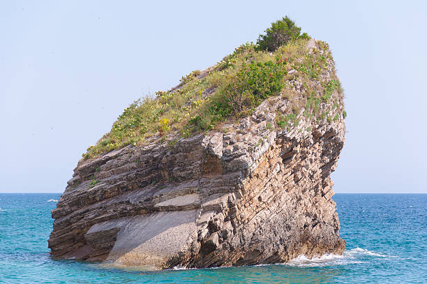 istock Rock in the sea at Budva shore, Montenegro. 620407188