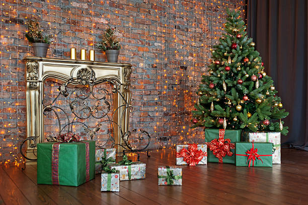 istock Decorated Christmas tree and gift boxes in living room 620407466