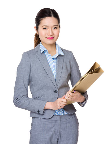 istock Businesswoman holding folders 620408306