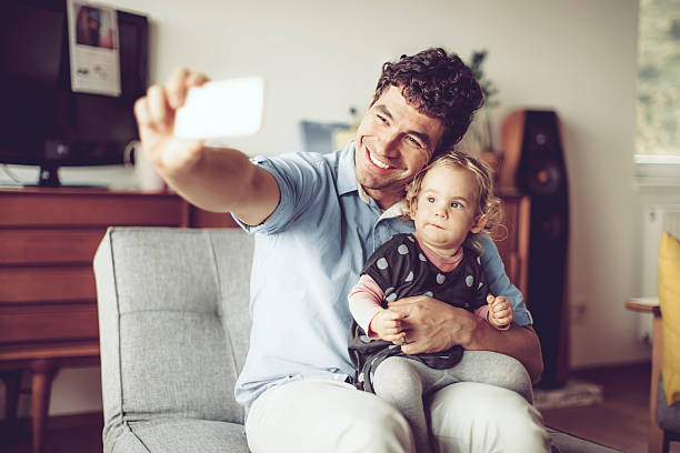 istock Father is taking selfies with his cute daughter 620409140
