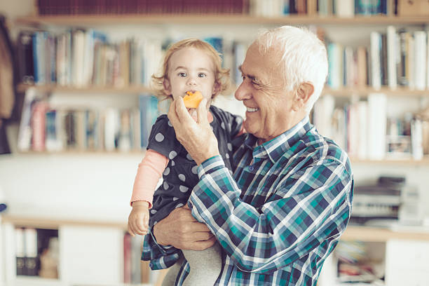 Cheerful multi-generation family having fun while spending time together at home. People happiness concept.