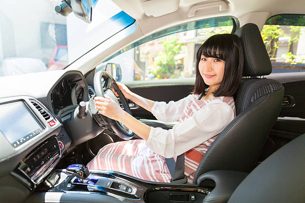 istock Japanese woman in a car 620411190