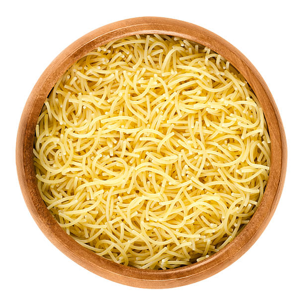 istock Filini short cut pasta in wooden bowl over white 620411928