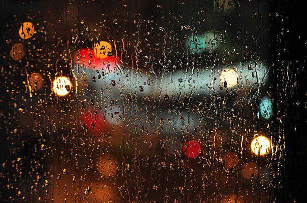 istock Night City Lights Through A Wet Window 620696574