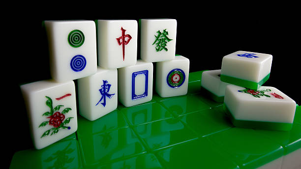 istock Mahjong tiles with black background 620696898