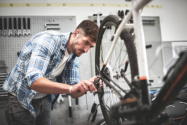 istock Mechanic repairing bicycle transmission 620697710