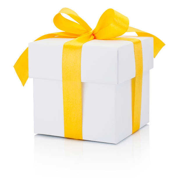 istock White gift box tied yellow ribbon Isolated on white background 620699232