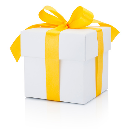 White gift box tied yellow ribbon Isolated on a white background