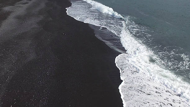 istock black sand beach at iceland 620699852