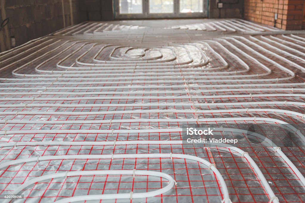 Heating posed in a under construction building Heat - Temperature Stock Photo