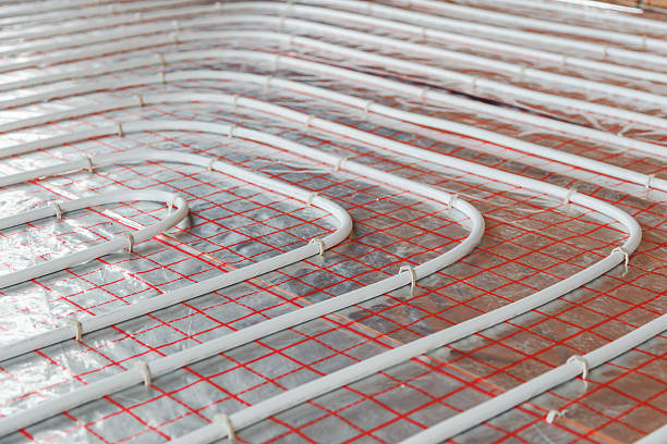 istock Underfloor heating installation. Close up on water floor  system interior 620701344
