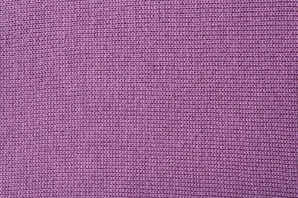 istock Purple knitted sweater - background. 620702440