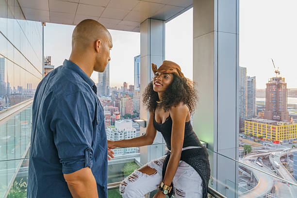 istock Young Latino couple have dinner and dating on rooftop 620703544