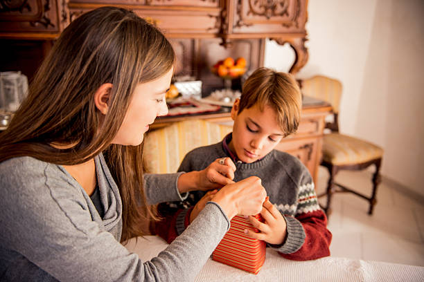 istock Mother and Son Wrapping Christmas Presents 620704086