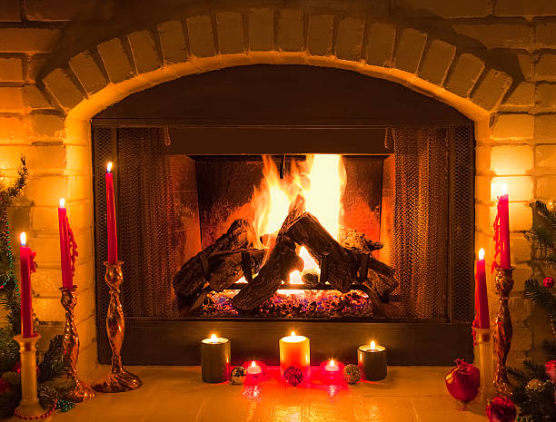 istock Old fashioned Christmas Decorated  Brick Fireplace with candlelight (P) 620705032