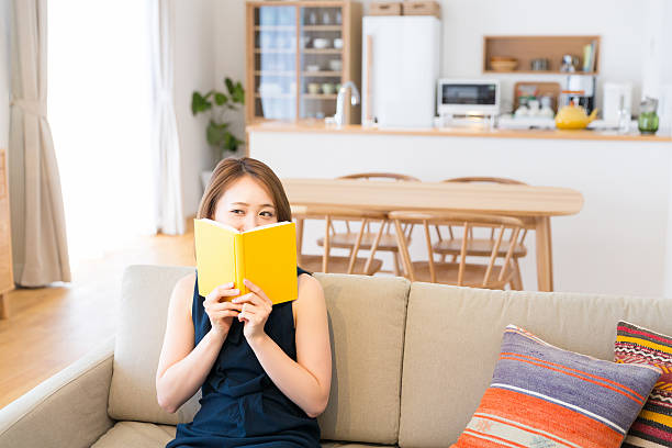 istock Japanese woman reading a book 620707062