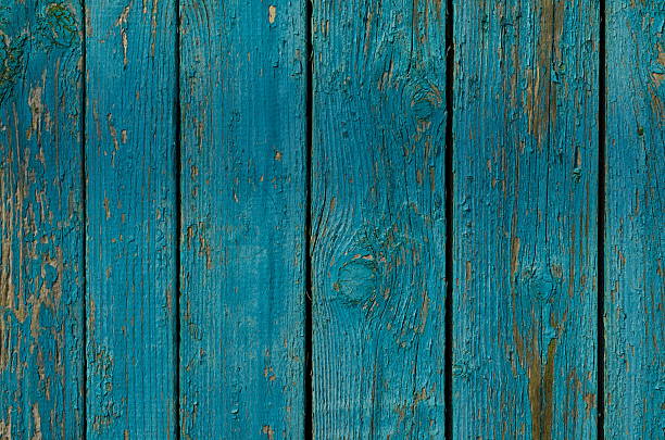 istock Weathered painted green wooden boards texture 620707240