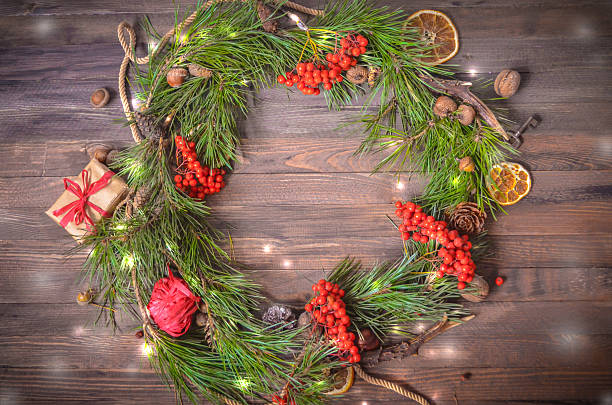 istock New Year Decoration with Wreath of Pine Branches and Rowan 620708538