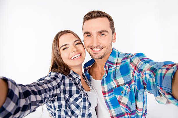 istock happy smiling young couple making selfie photo 620708580