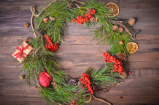 istock New Year Decoration with Wreath of Pine Branches and Rowan 620708606