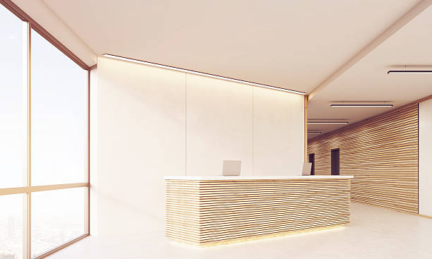 istock Side view of reception desk in long sunlit corridor 620708666