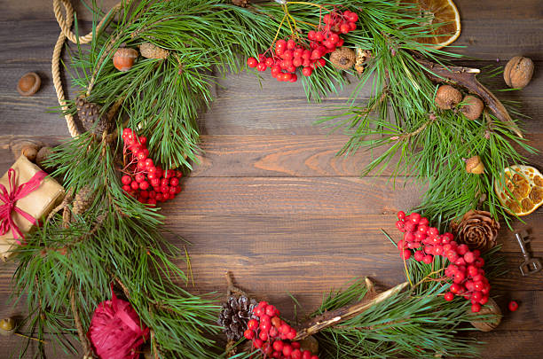 istock New Year Decoration with Wreath of Pine Branches and Rowan 620709344