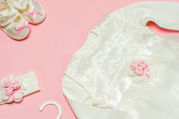 istock Clothes for baby girl on a pink background. Copy space 620709856