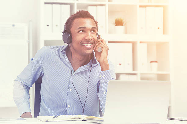 istock Smiling black man listening to music, toned 620710544