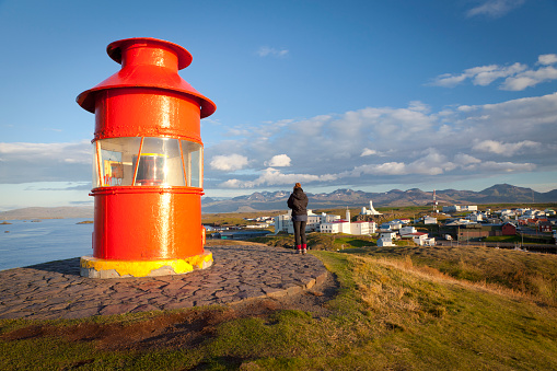 Girl admiring Stykkishólmur from the lighthouse, Iceland.
