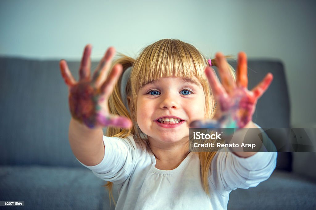 Small girl playing with colors 2-3 Years Stock Photo