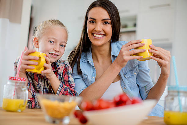 istock Daughter and mother eating breakfast 620712424