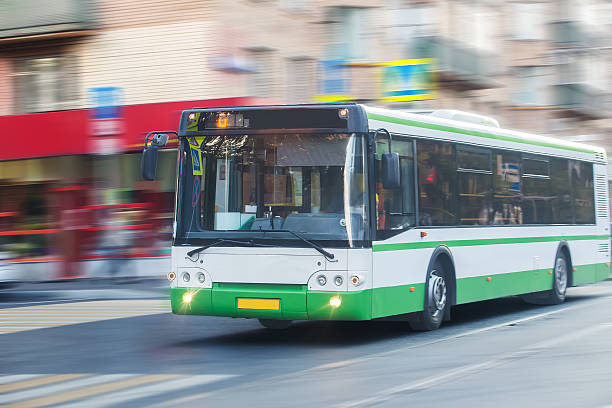 istock bus goes along street 620712554