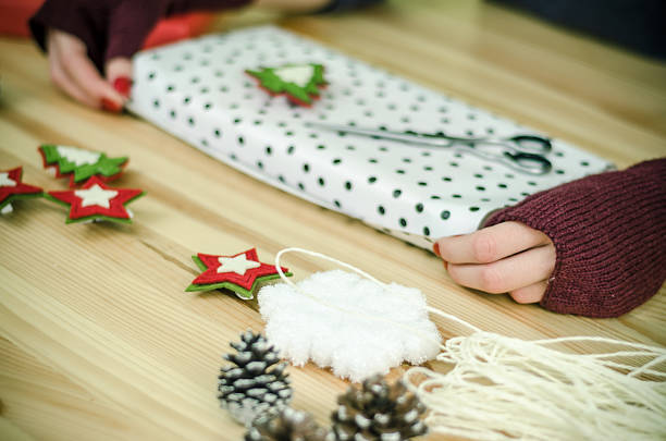 istock female hands with gloves packed gifts 620713484
