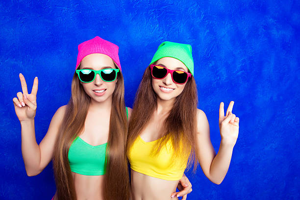 istock Pretty women in spectacles gesturing with two fingers 620714776